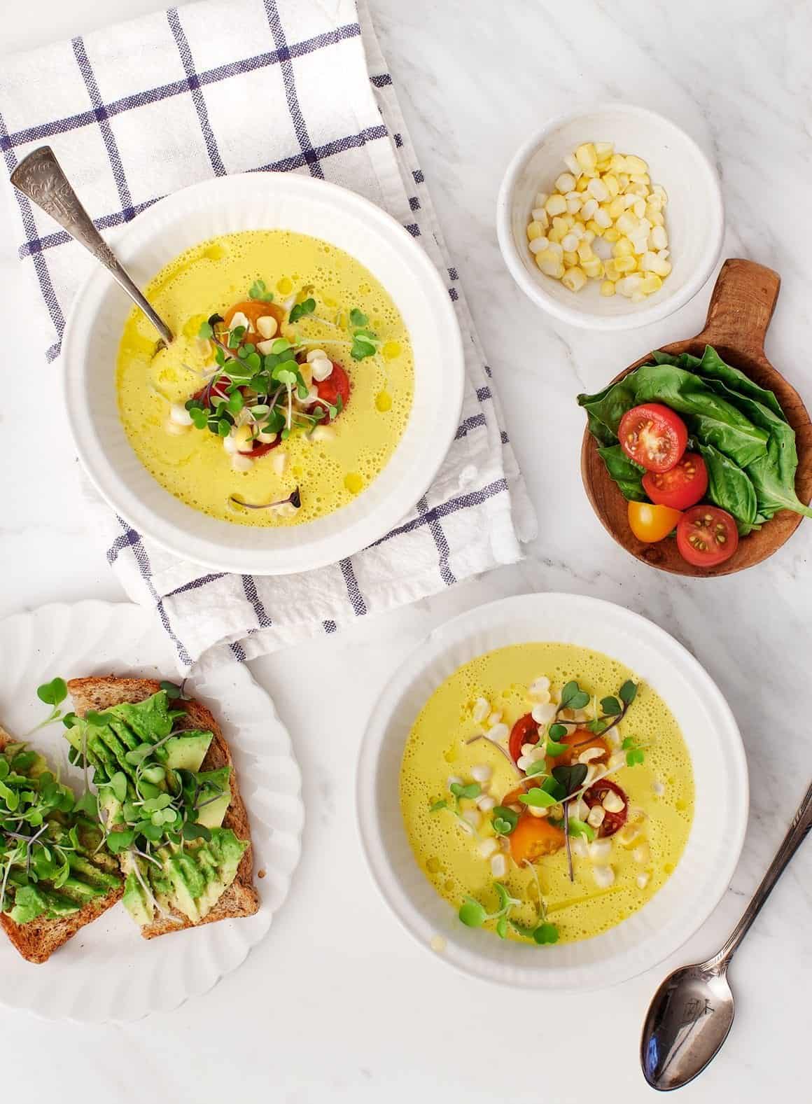 Sweet Corn Gazpacho in bowls with spoons