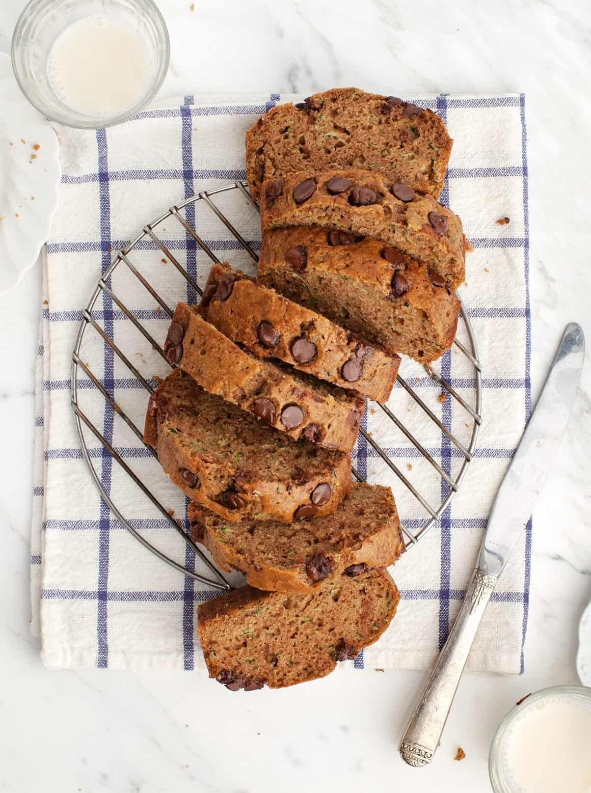 Zucchini Bread sliced on a cooling rack